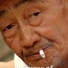 Man with a cigarette, Dali (Yunnan)